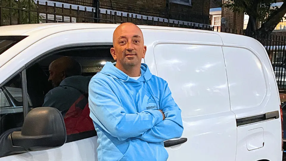Allen Patrick beside the Bright Light Window Cleaning van