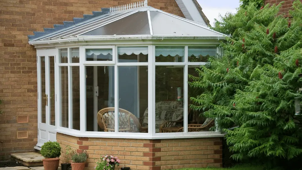 Residential conservatory exterior with glazed roof and windows